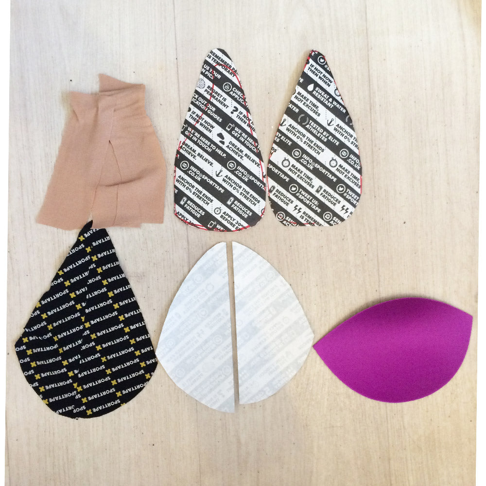 Fabric pieces with printed patterns on a wooden surface