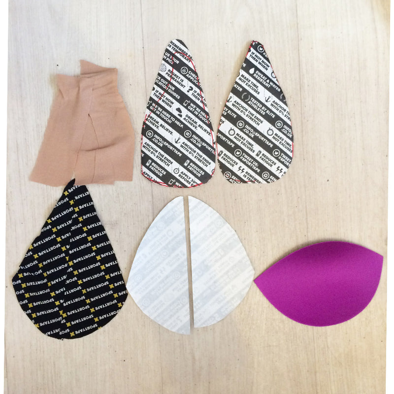 Fabric pieces with printed patterns on a wooden surface